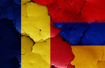 flags of Romania and Armenia painted on cracked wall