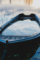 Old rowboat sinking lake water morning sunrise