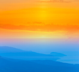 blue misty mountain valley silhouette  under dramatic red evening sky, stylized natural background