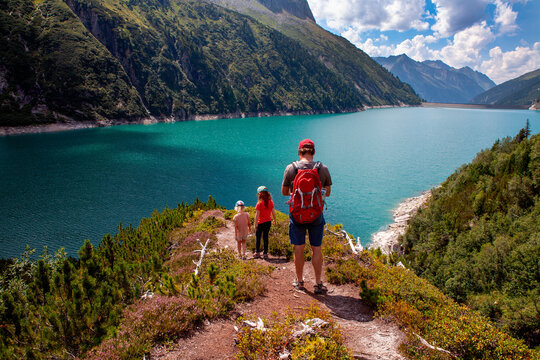 Man with daughters hiking on mountain at Zillertral, Austria