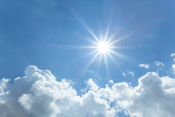 Naklejka na ściany i meble blue cloudy sky with sparkle sun, natural sky background
