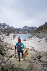 women dog mountain lake snow