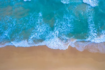 Rolgordijnen aerial top view Wave after wave swept towards the shore. . white foamy waves crash along the beach..Beach sea space area. Blue sea, waves crashing at Karon Beach, Phuket. © Narong Niemhom