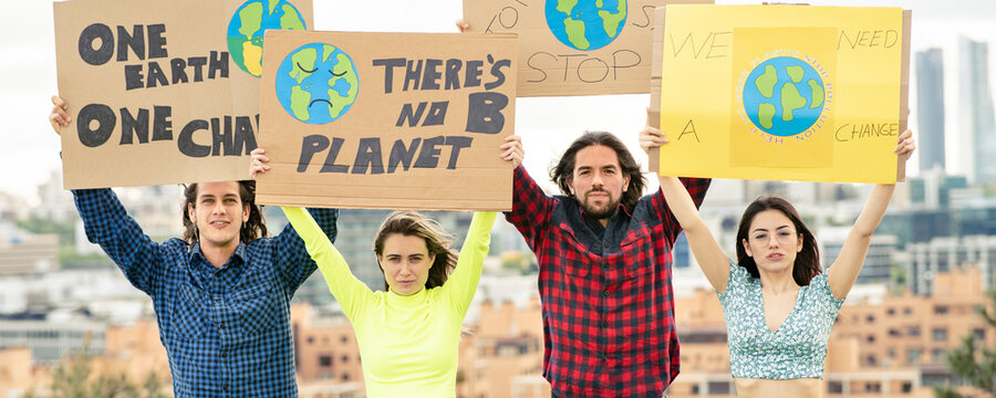 Men and women with banner protesting on climate change
