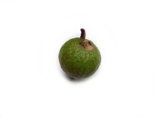 A small unripe guava isolated on white background