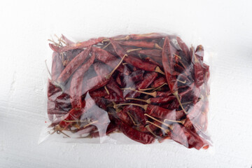 Cellophane bag with hot red pepper pods.