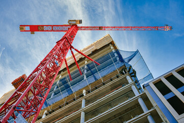 Highrise Building Site in Berlin. Looking up at the construction site of a high-rise building with...