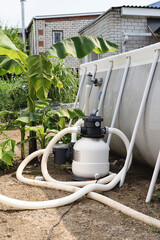 Sand filter plant at a pool in the garden