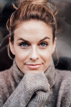 Mid adult woman with blue eyes smiling