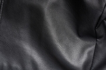 Closeup of black heavy leather material with deep texture, highlights and shade for design, texture background and displacement maps, with large canvas and copy space