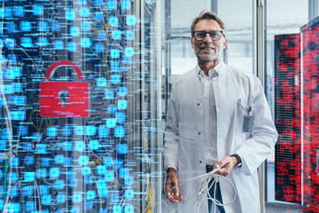 Male technician holding cable at data center