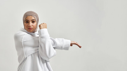 Cute young arabian girl doing warm up