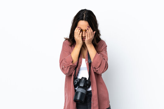 Young photographer woman over isolated white background with tired and sick expression