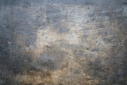 Grungy dark concrete wall with stucco, photo texture,