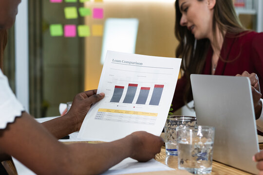 Businesswoman holding data document in meeting
