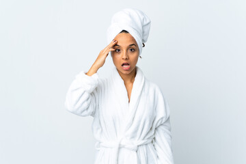 Young woman in bathrobe over isolated white background has realized something and intending the solution