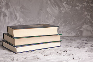 Stack of colorful books. An open book on a stack of books. The concept of education, international...