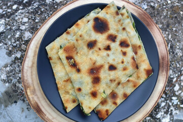 Thin dough filled with mangold, garlice and olive oil. Traditional food in Dalmatia, Croatia. Top view.