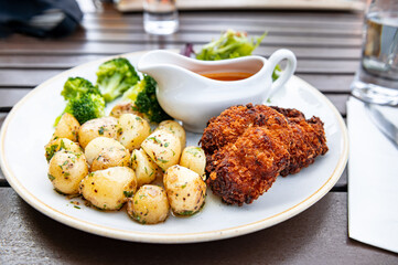 Healthy lunch in Pub with Fishcakes and baby potatoes