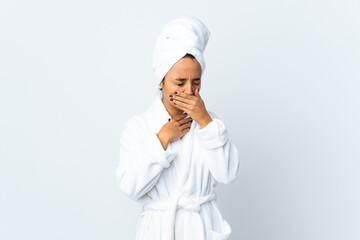Young woman in bathrobe over isolated white background coughing a lot
