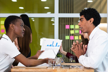 Entrepreneurs discussing over business plan in meeting