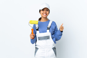 Painter woman over isolated white background showing ok sign and thumb up gesture