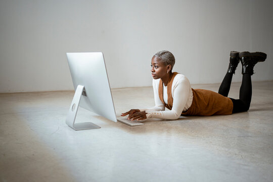 Businesswoman working on computer at home