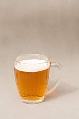Mug with beer on a light gray background