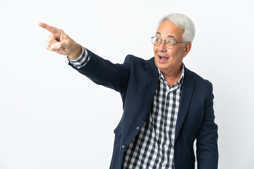 Middle age Brazilian man isolated on white background pointing away