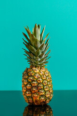 Fresh pineapple on green blue background	