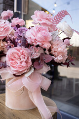 Preserved roses with dried flowers bouquet closeup. Eternal, stabilized, forever rose flower. Beautiful flowers.