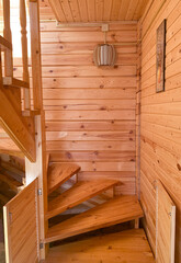Fototapeta na wymiar wooden staircase in the house, interior, house made of timber