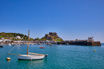 Image of Gorey Harbour with Gorey Castle in the background. Jersey CI