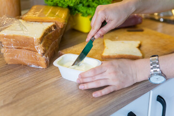 making morning sandwich at home kitchen