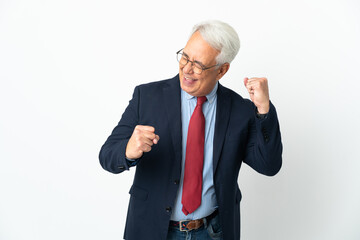 Middle age Brazilian business man isolated on white background celebrating a victory