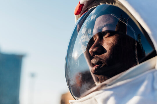 Thoughtful astronaut looking away
