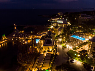 Fototapeta premium night evening drone view of hotel in Bulgaria, aerial view from above
