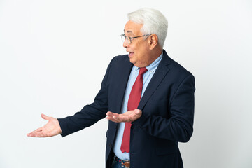 Middle age Brazilian business man isolated on white background with surprise expression while...