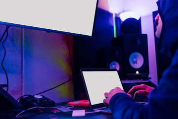 Young man hacking computer data at home