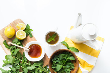 Mint tea with fresh mint leaves, lemon, and honey