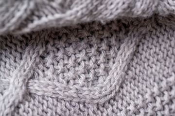 Fototapeta na wymiar Fragment of a knitted woolen plaid close-up. 