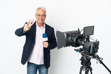 Reporter Middle age Brazilian man holding a microphone and reporting news isolated on white background happy and counting three with fingers