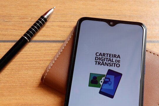 Digital traffic wallet app on smartphone. Brazilian driving and transit concept. Carteira Digital de Tr&acirc;nsito Brasileira. CNH concept. 