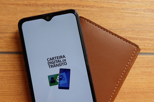 Digital traffic wallet app on smartphone. Brazilian driving and transit concept. Carteira Digital de Tr&acirc;nsito Brasileira (CNH). 