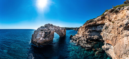 Spain, Balearic Islands, Cala Santanyi, Aerial view of rock gate Es Pontas at coast pf Mallorca