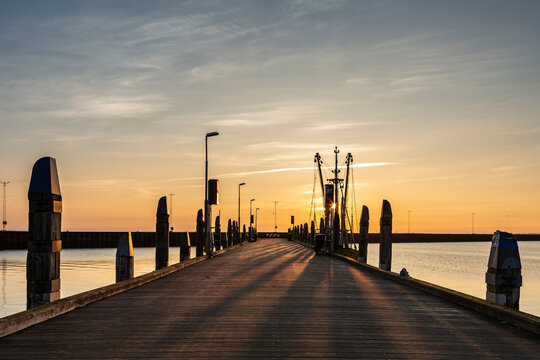 Denmark, Romo, Empty pier at sunset