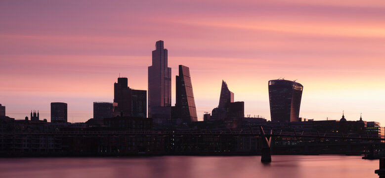 UK, England, London, Panoramic view of River Thames and city skyline at dawn