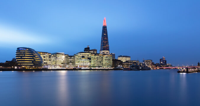 UK, England, London, Panorama of River Thames at dusk with skyline of More London in background