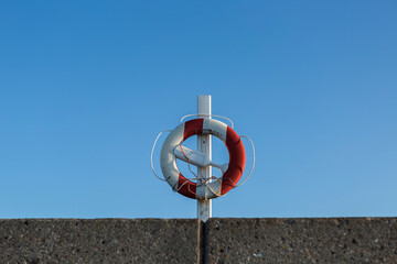Denmark, Romo, Life belt hanging against clear sky