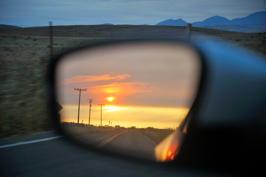 USA, California, Looking in rearview mirror on Green Valley Road at sunset